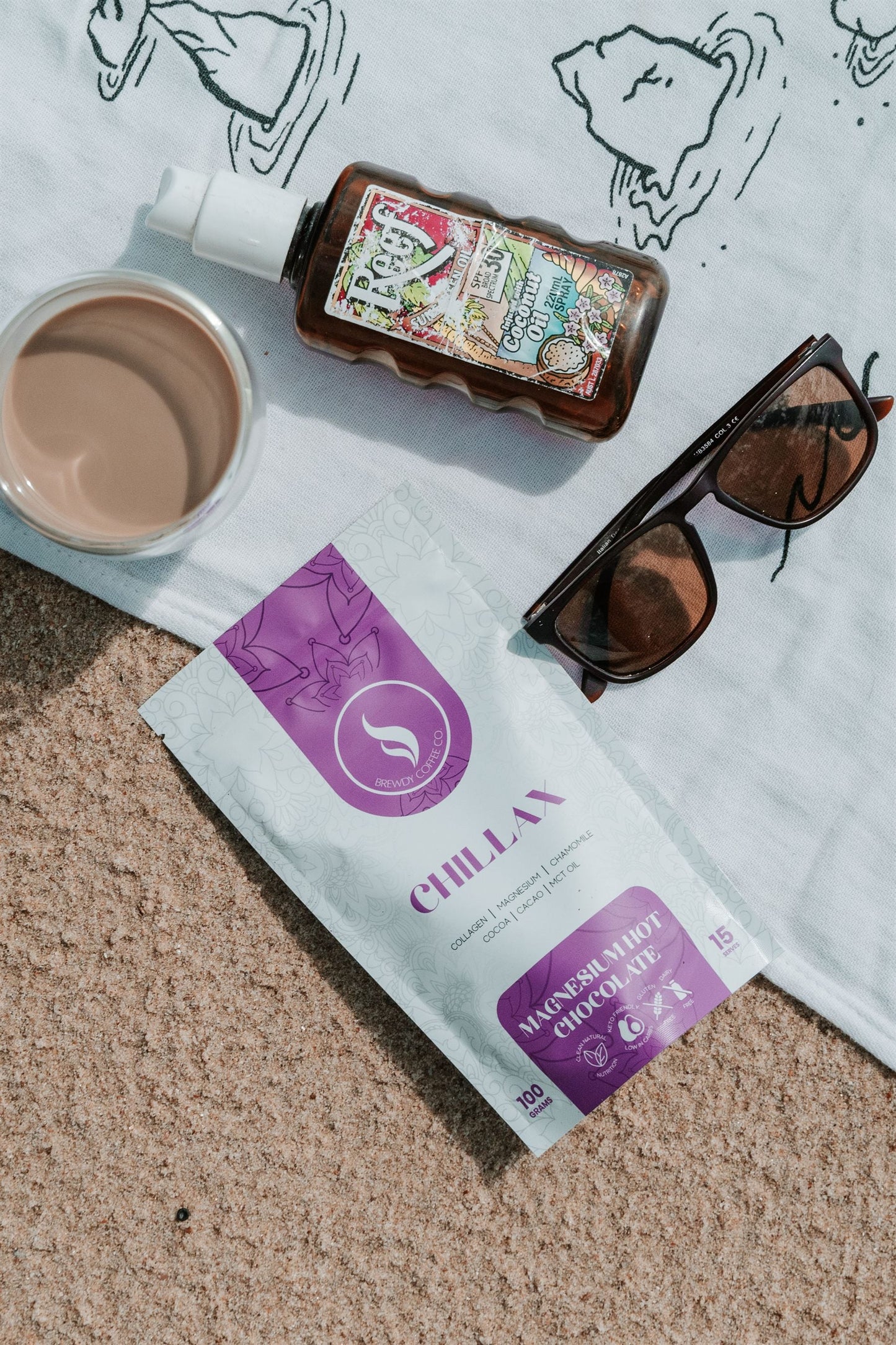 Chillax magnesium hot chocolate on a beach towel