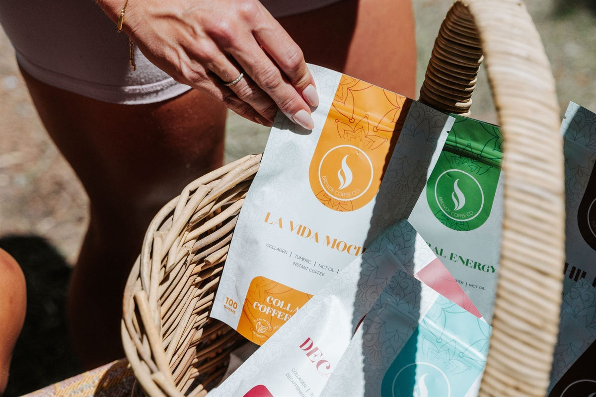 Hand reaching into a basket of colourful Brewdy blends