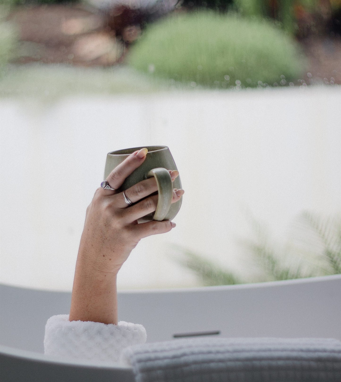 Self care moment with a mug in the bath
