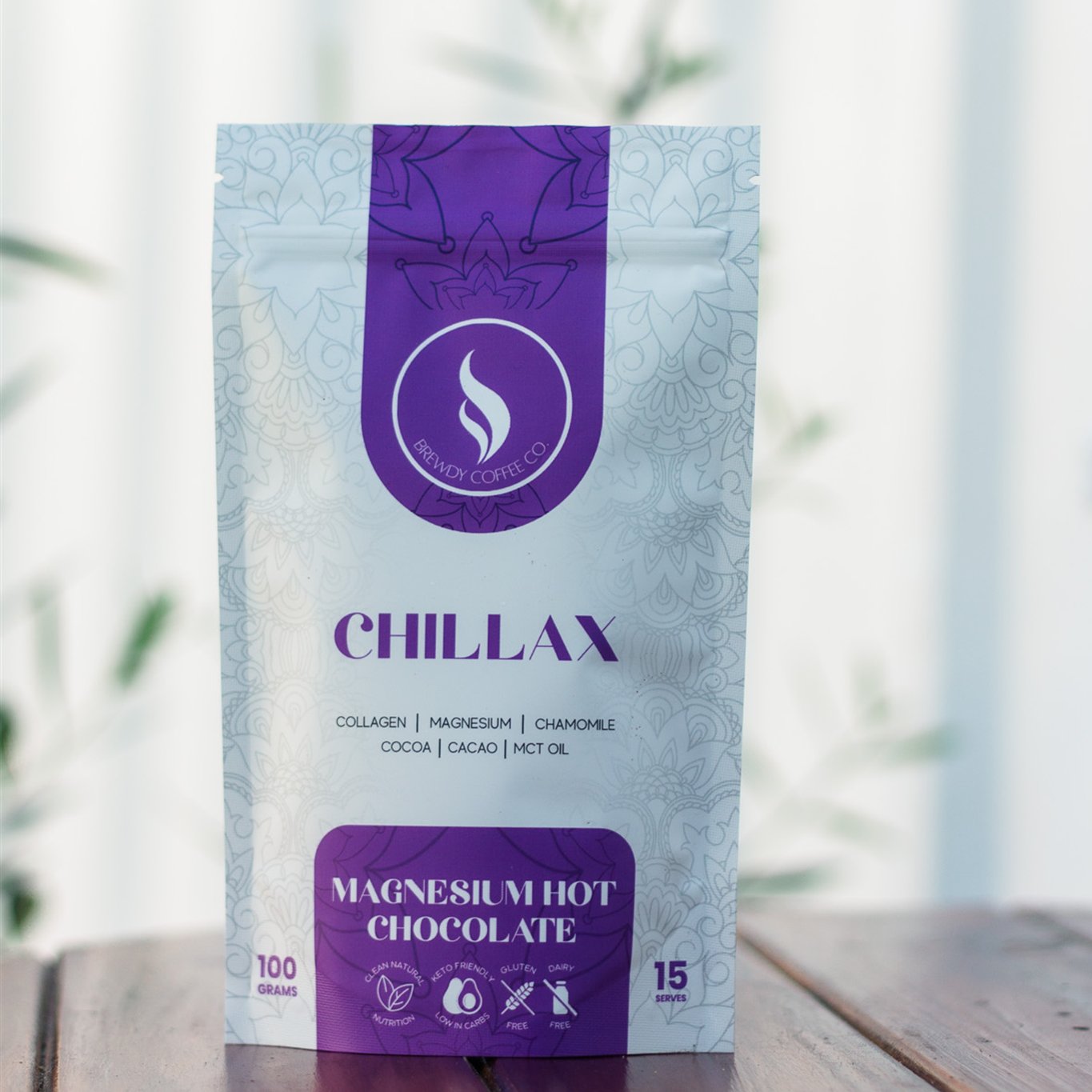Chillax magnesium hot chocolate pouch on a timber table